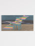 Abstract artwork with a blue chair and colorful steps on a beach.
