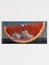 Sliced grapefruit with clouds inside on a blue background