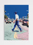Abstract street scene with a person in a blue outfit and taxis.