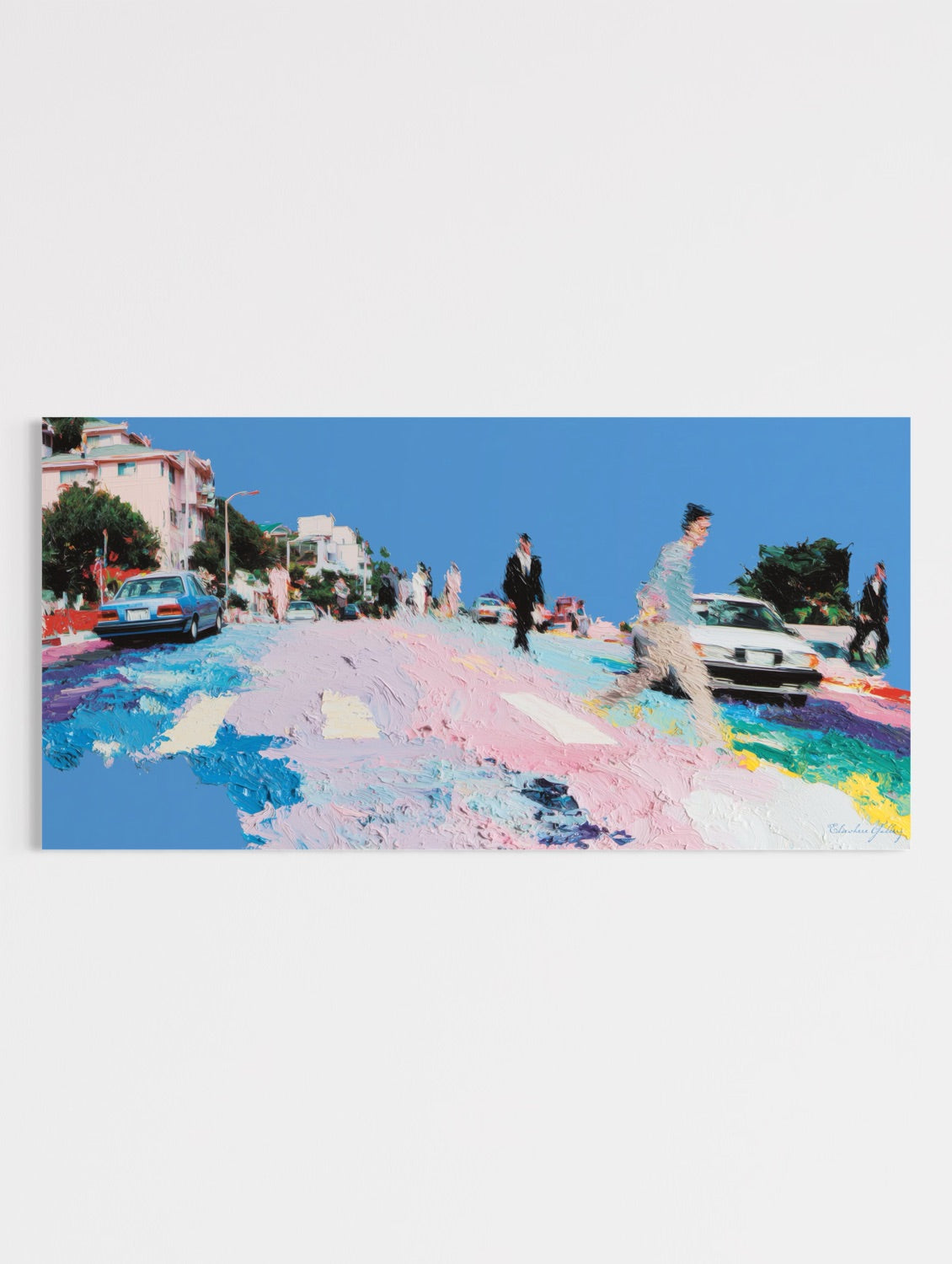 Colorful street with people and cars on a clear day