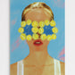 Artistic depiction of a woman with tennis balls over her eyes against a blue sky.