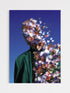 Person with floral overlay against a blue background