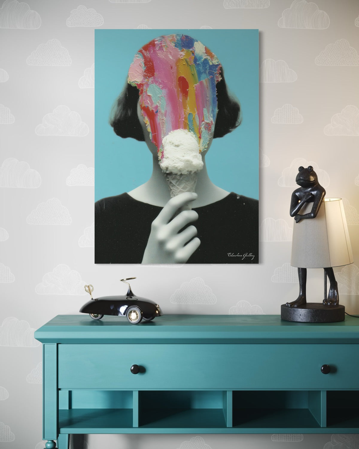 Colorful abstract painting of a face on a blue wall above a teal console table with decorative items.