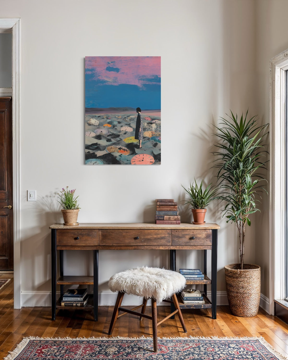 Room interior with a wooden console table, plants, and a colorful painting on the wall.