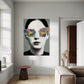 Modern interior with a painting of a person wearing colorful sunglasses on the wall.