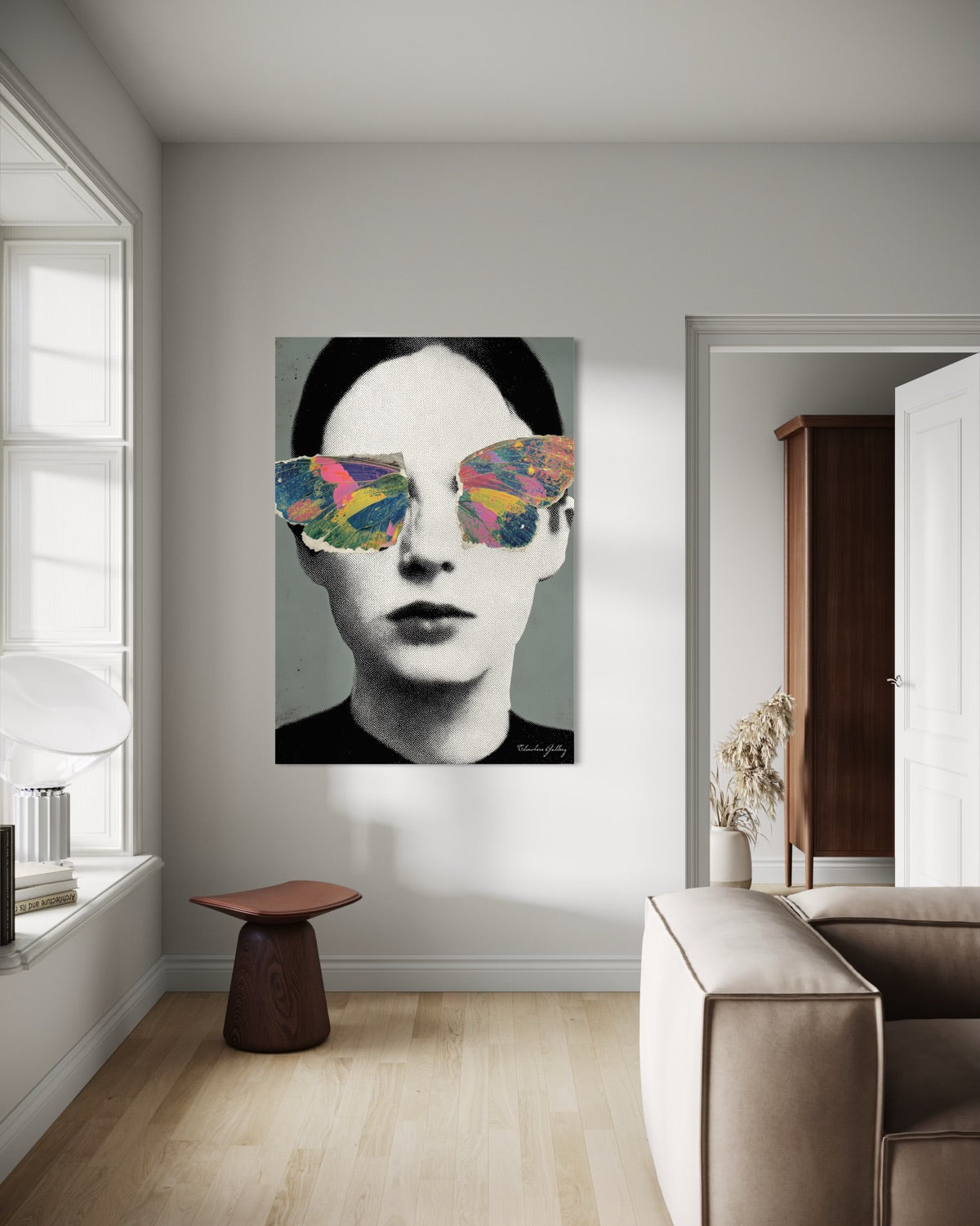 Modern interior with a painting of a person wearing colorful sunglasses on the wall.