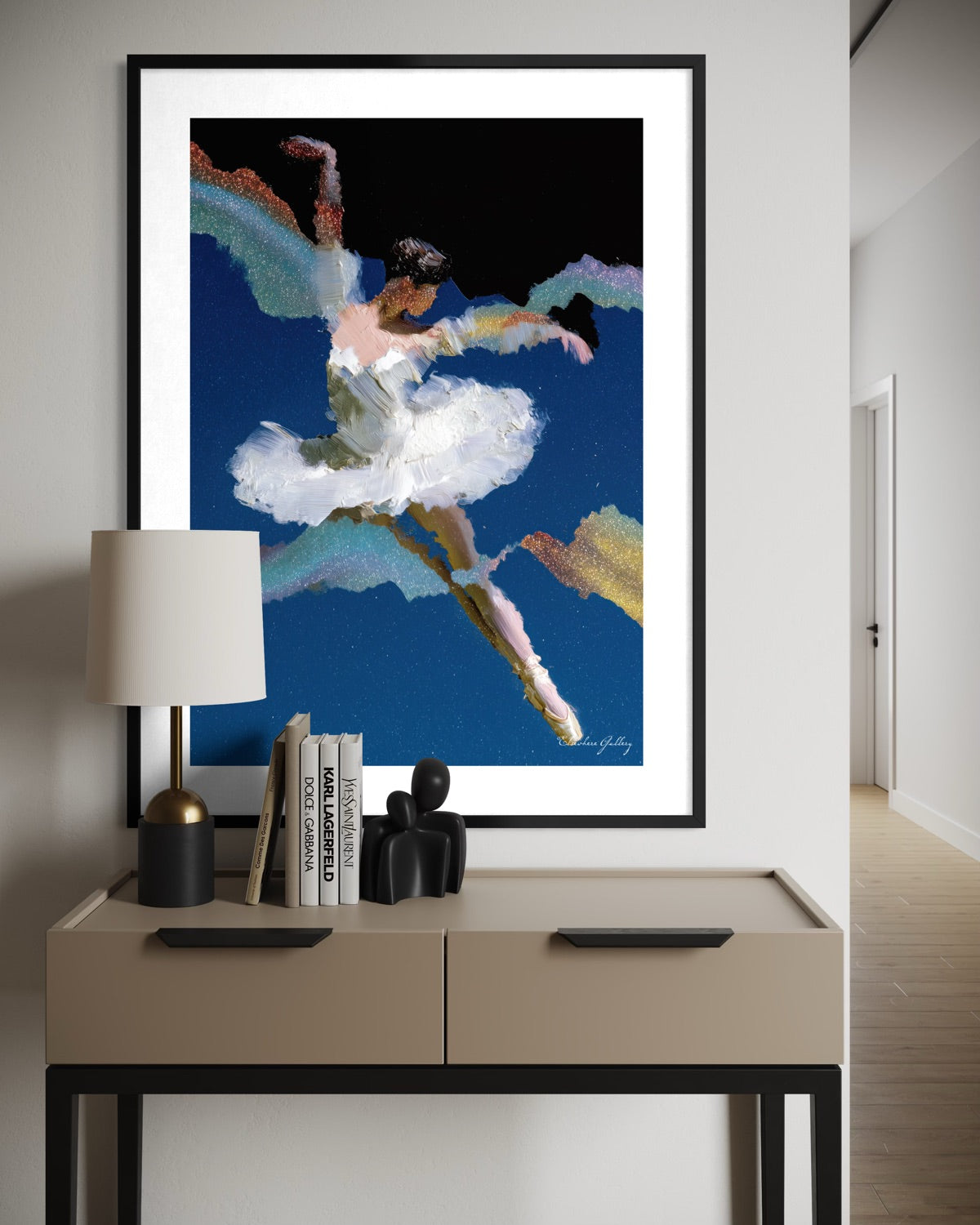 Framed abstract artwork of a dancer on a wall above a side table with decor items.