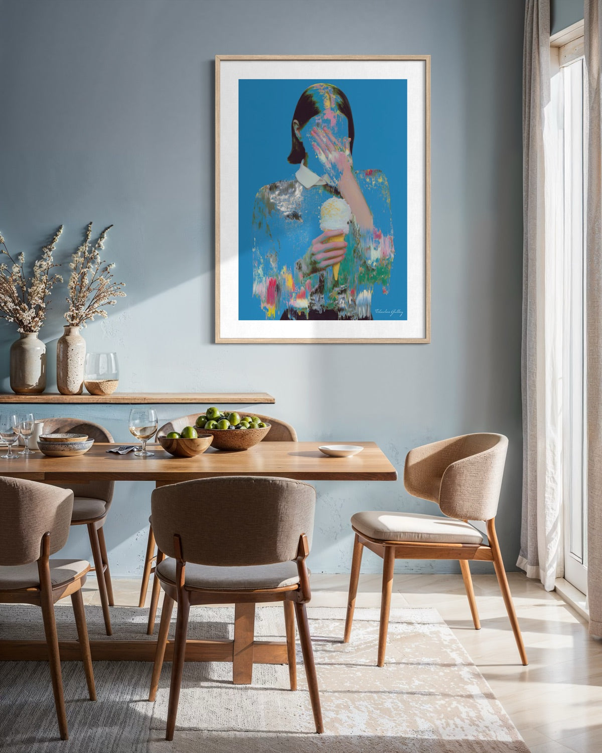 Dining room with a wooden table and chairs, featuring a colorful abstract painting on the wall.