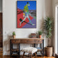 Colorful abstract painting on a wall above a wooden console table with decor items.