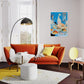 Modern living room with orange sofa, yellow rug, and decorative elements.