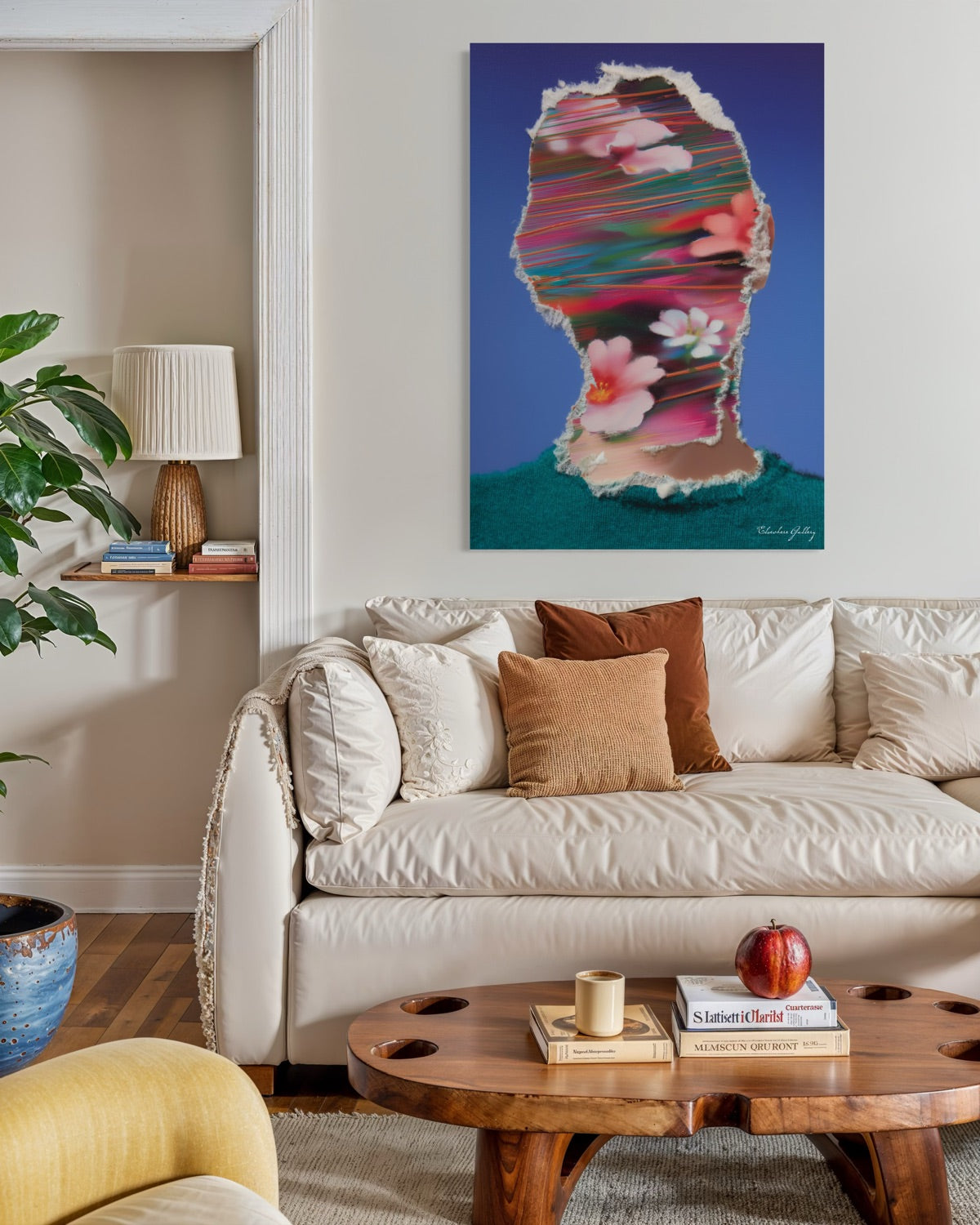 Living room with a colorful abstract painting above a beige sofa.