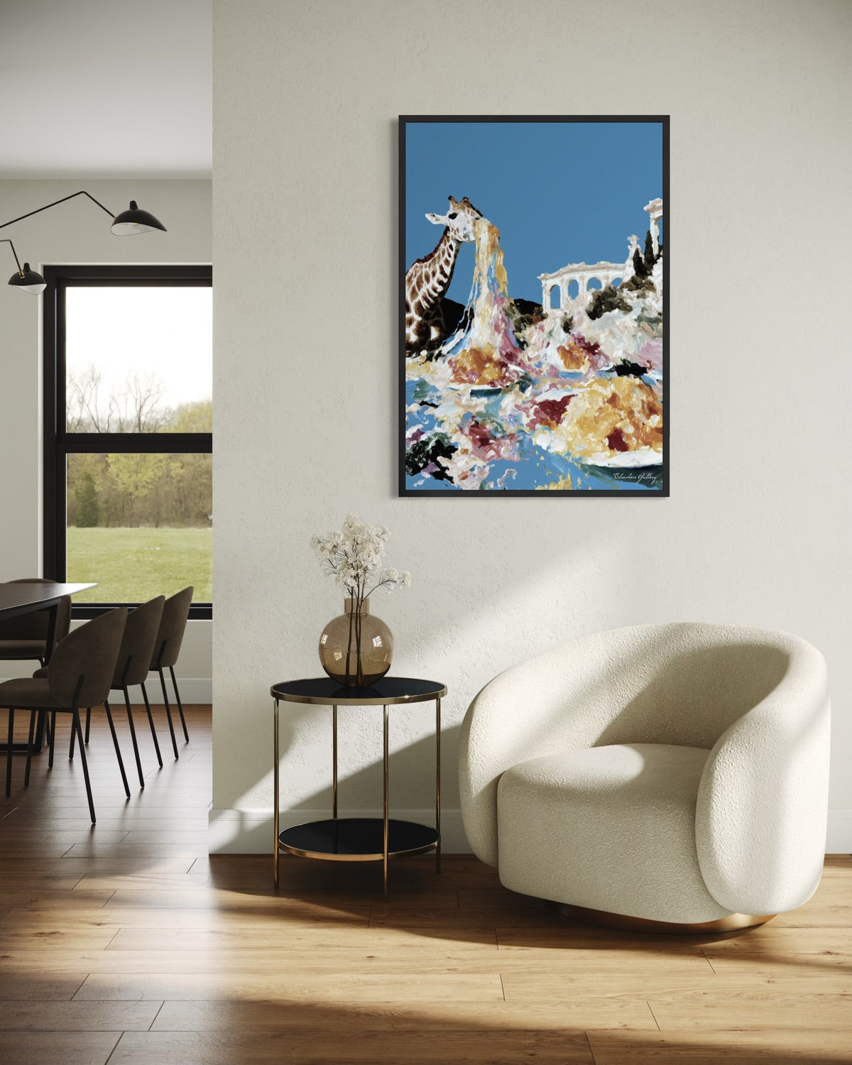 Modern living room with a white armchair, round table, and colorful abstract painting on the wall.