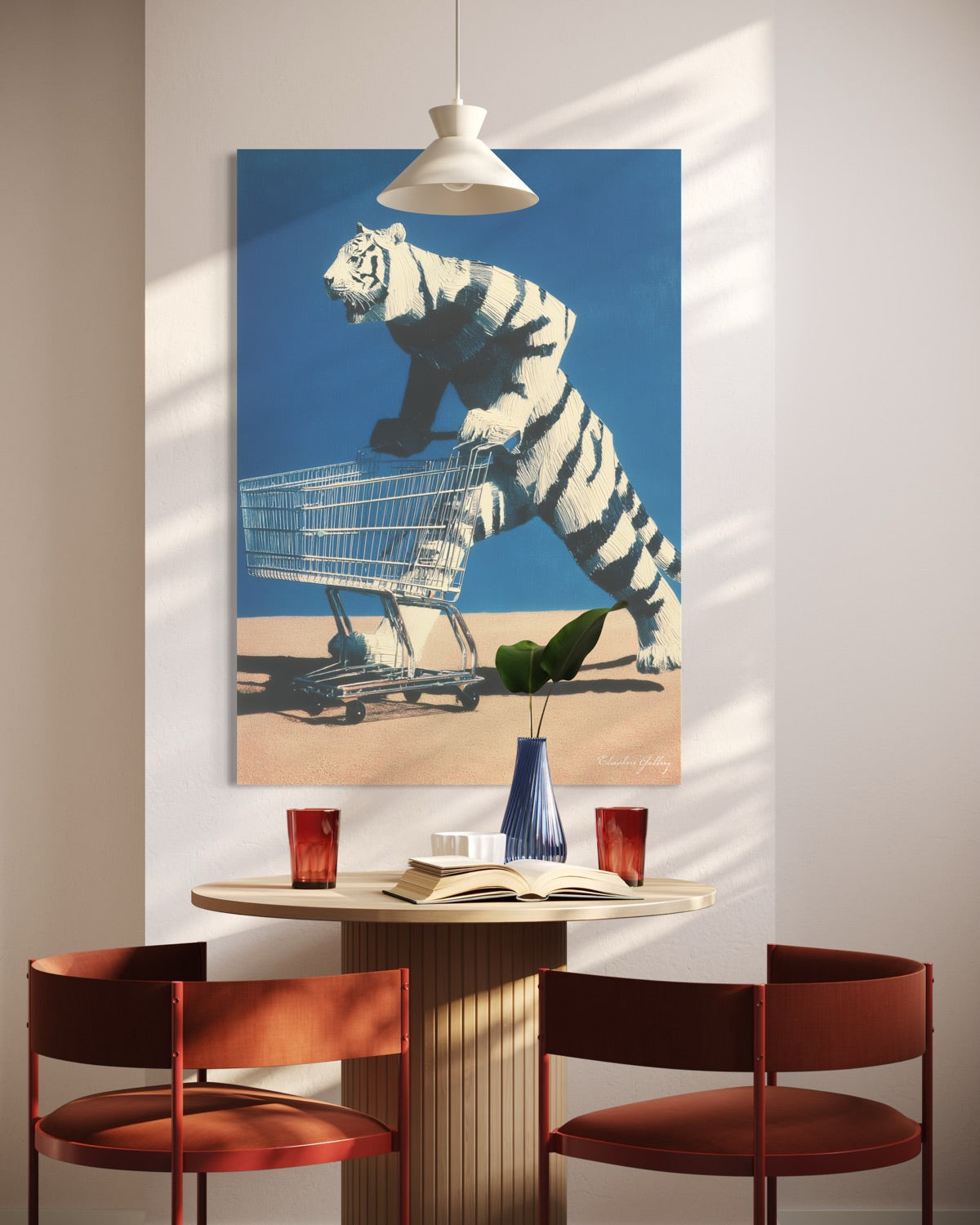 Dining area with a tiger pushing a shopping cart on a wall art above a table.