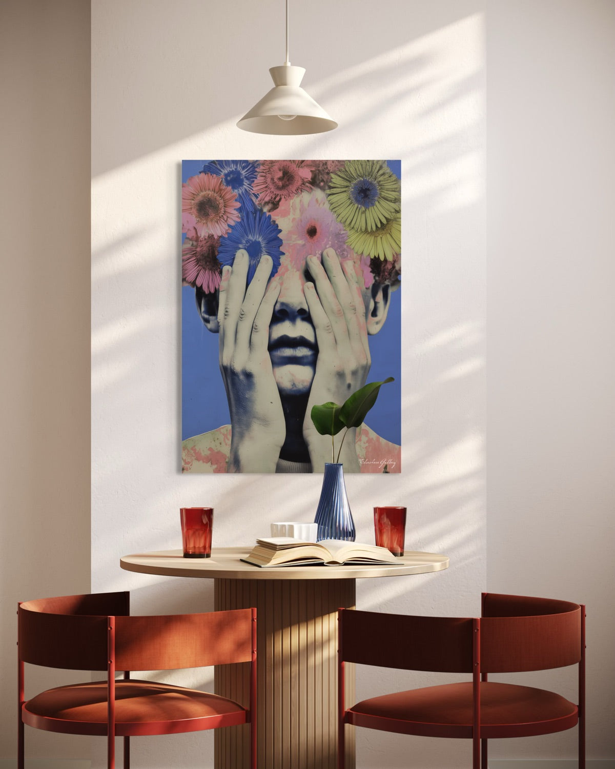 Dining area with a table, chairs, and a colorful floral painting on the wall.