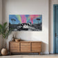 Modern interior with a wooden sideboard, decorative items, and a colorful abstract painting on the wall.