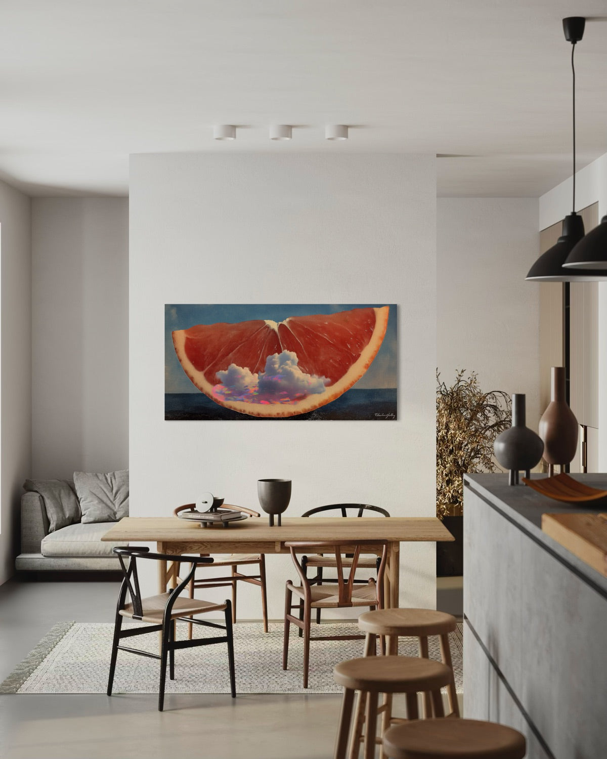Modern kitchen with a dining area and a painting of an orange on the wall.