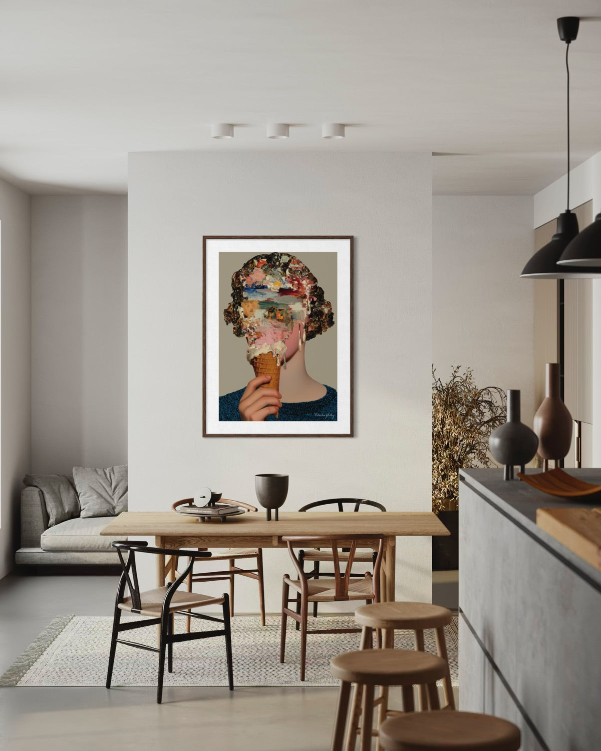 Modern kitchen with a dining table and chairs, featuring a framed artwork on the wall.