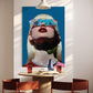 Modern interior with a large abstract painting of a woman's face on a wall above a dining table.
