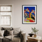 Living room with a sofa, coffee table, and colorful abstract art of giraffes on the wall.