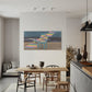 Modern dining area with a colorful abstract painting on the wall.