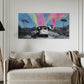Beige sofa in a living room with a colorful abstract painting on the wall.
