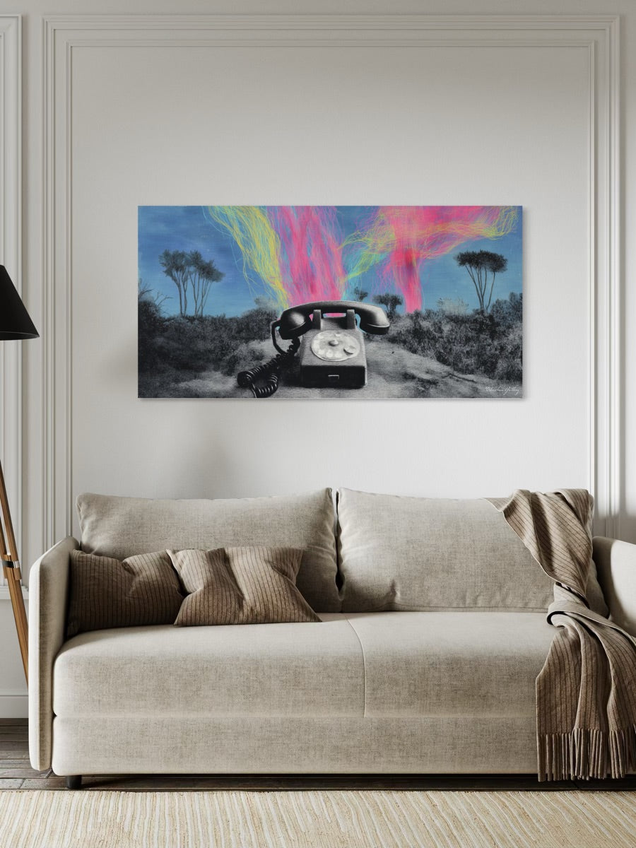 Beige sofa in a living room with a colorful abstract painting on the wall.