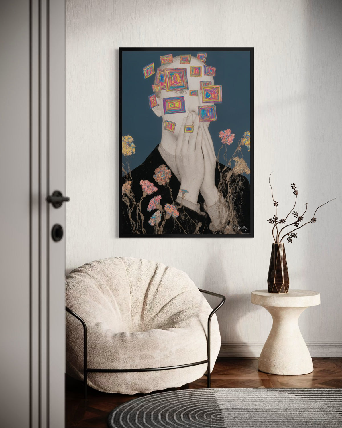 Framed abstract art piece on a wall above a chair in a room.