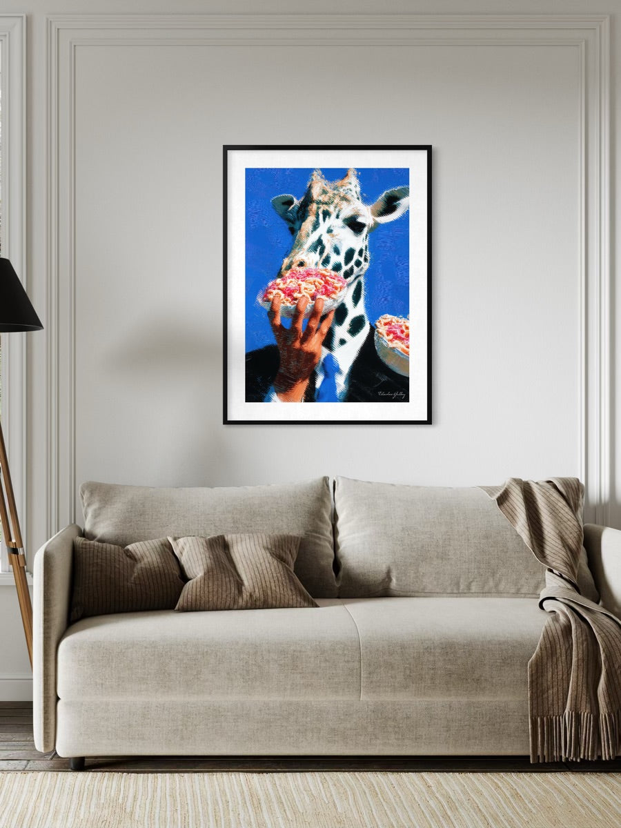 Framed artwork of a cow eating pizza on a wall above a beige sofa.