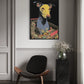 Modern interior with a black chair, black side table, and a colorful painting of a dog in a shopping cart on the wall.