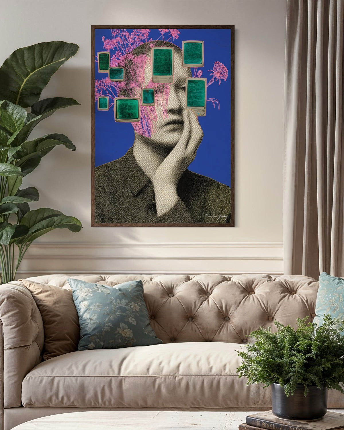 Abstract art piece on a wall above a beige sofa with decorative pillows.