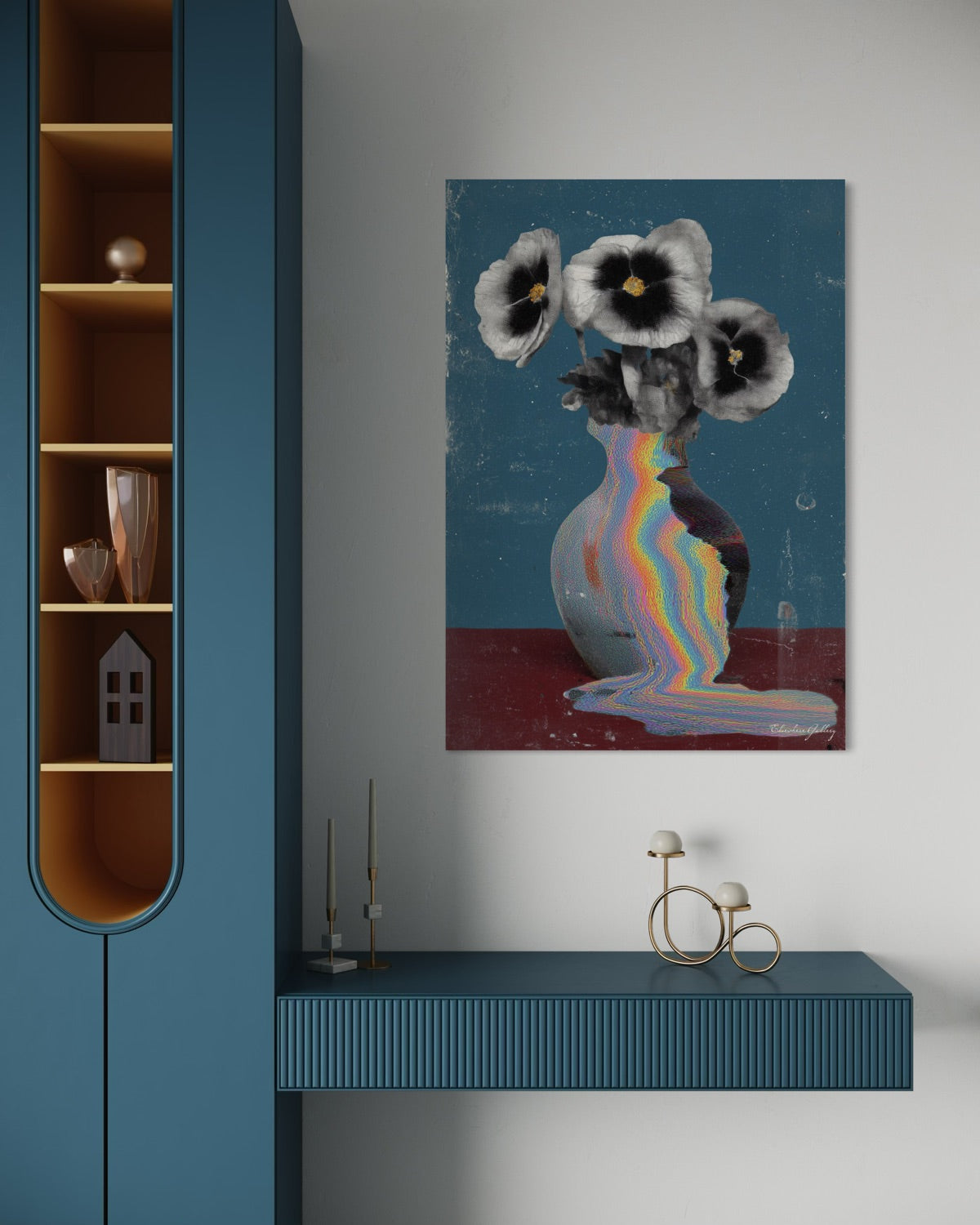 Abstract painting of flowers with a rainbow on a wall above a blue cabinet.