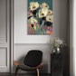 Modern interior with a black chair, marble side table, and abstract floral painting on the wall.