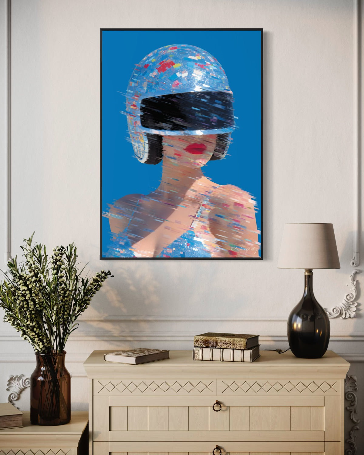 Framed artwork of a stylized woman with a colorful helmet on a wall above a cabinet.