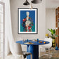 Dining room with a blue table and colorful abstract painting on the wall.