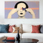 Modern living room with a large abstract painting on the wall, a white sofa with colorful pillows, and a black coffee table.