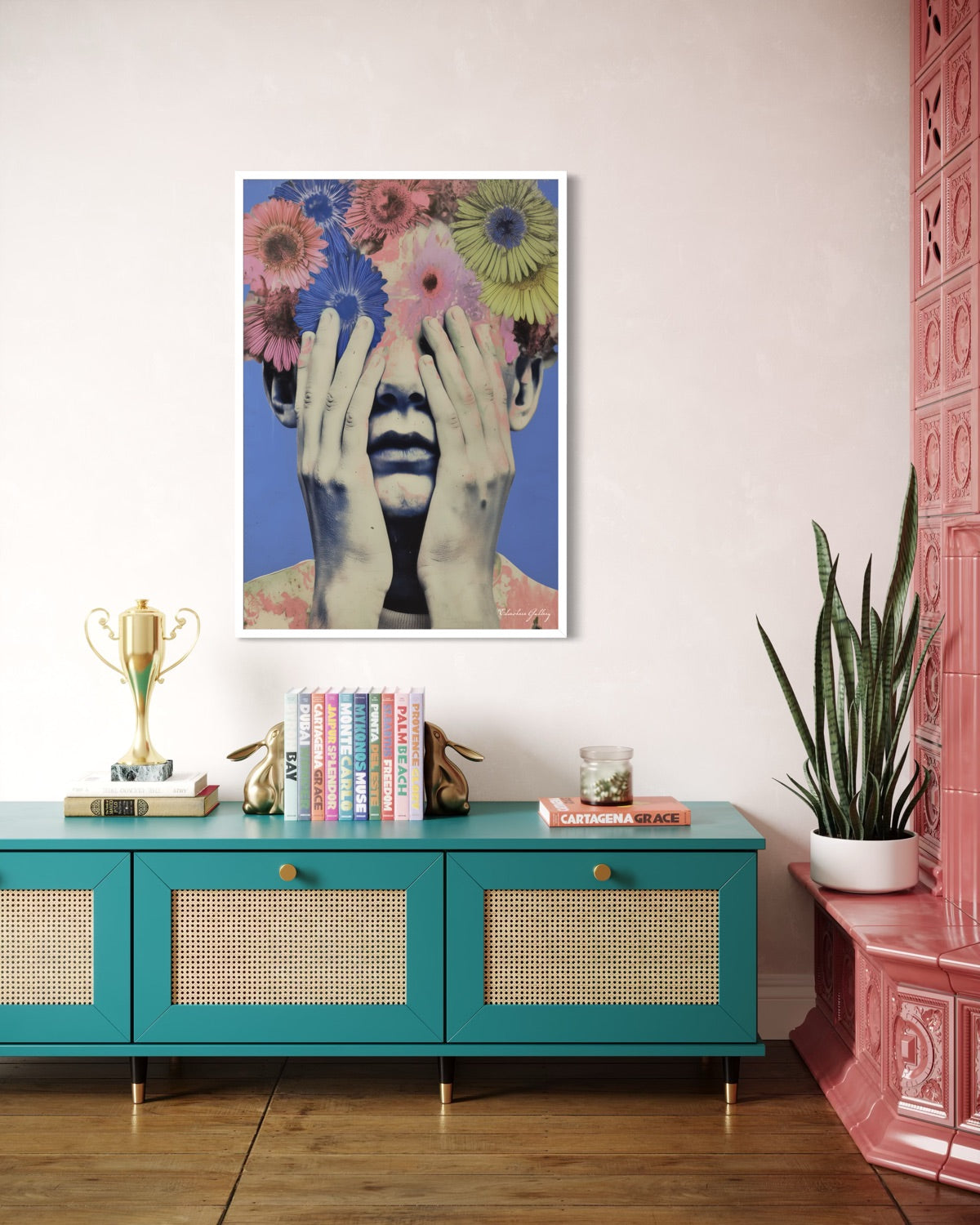 Colorful abstract art piece on a wall above a teal console table with decorative items.