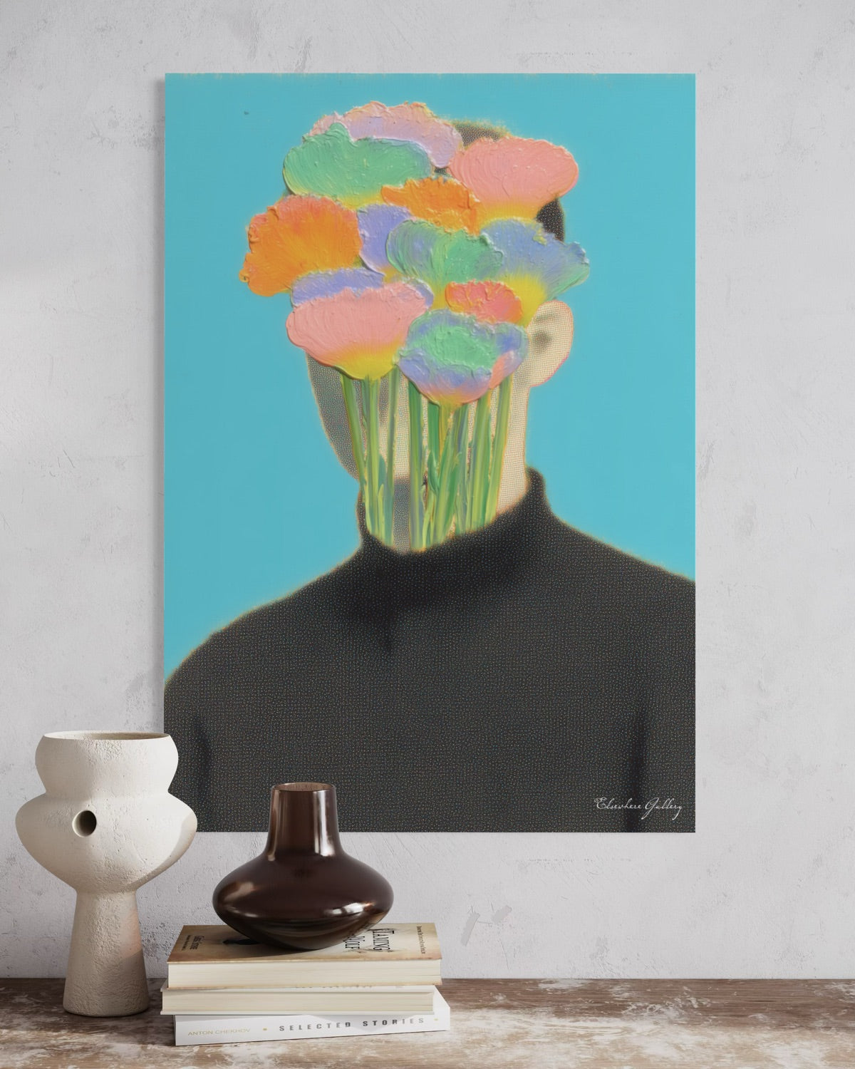 Abstract art print of a person with colorful flowers replacing their head on a blue background, displayed on a wall above books and vases.