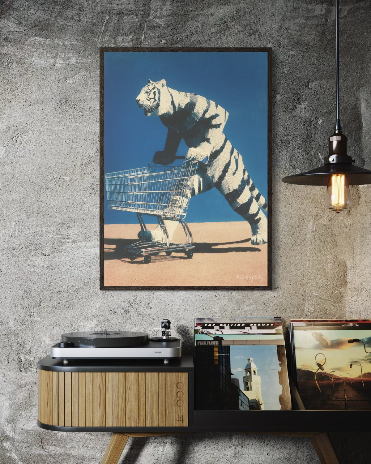 Framed artwork of a tiger pushing a shopping cart on a wall above a record player.