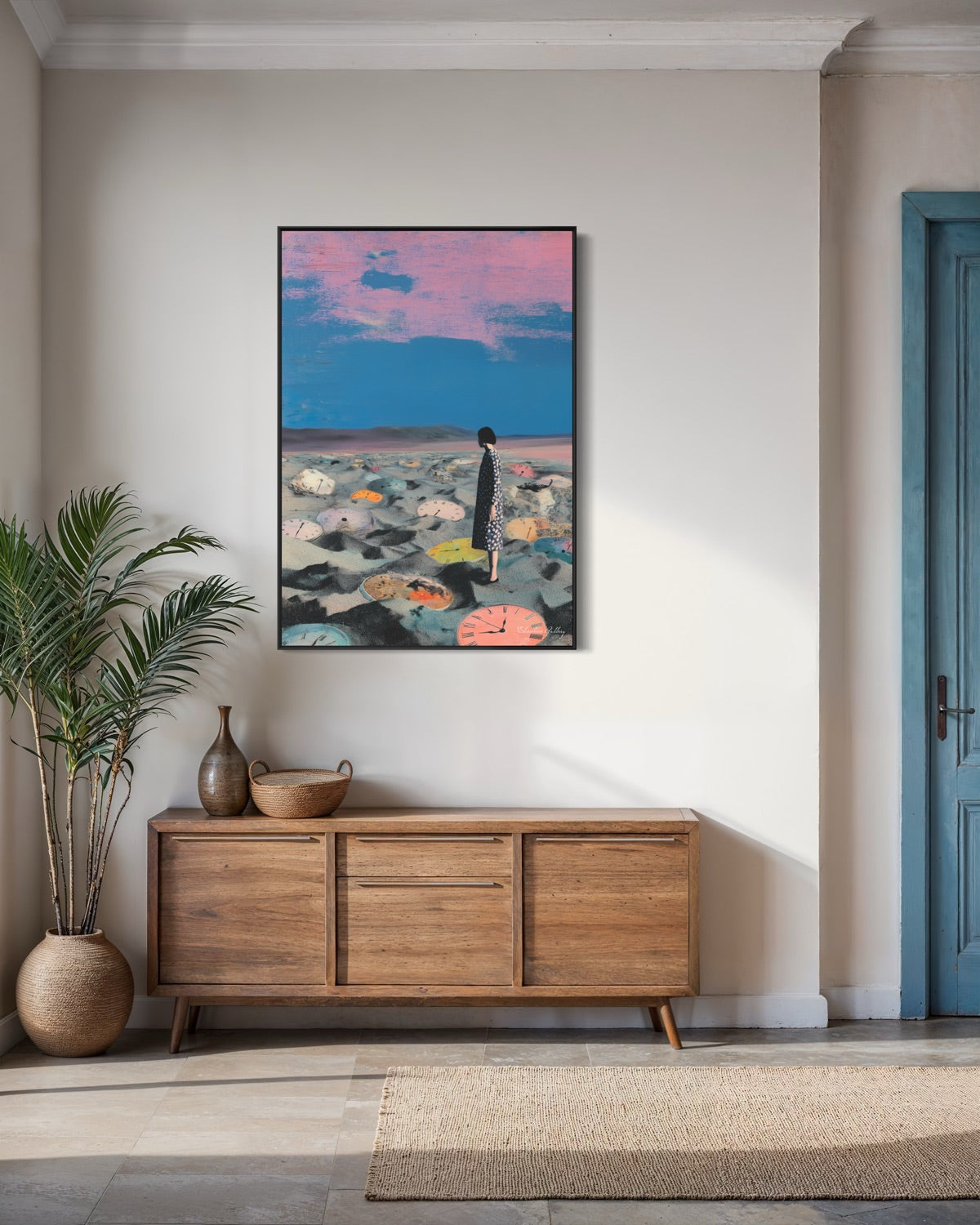 Modern interior with a wooden sideboard, plant, and colorful abstract painting on the wall.