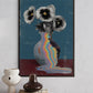 Framed abstract art of flowers and a vase with a rainbow effect on a wall.