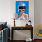 Modern interior with a painting of a person wearing a helmet on a blue background, a lamp, and a chair.