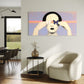 Modern living room with a white armchair, side table, and abstract painting on the wall.