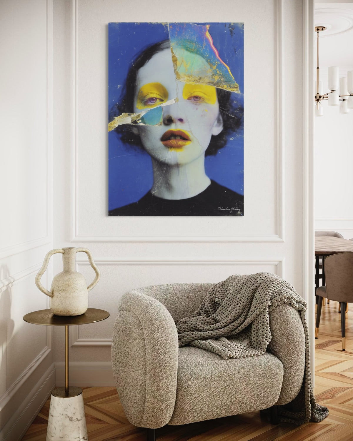 Modern interior with a textured armchair, side table, and abstract art on the wall.
