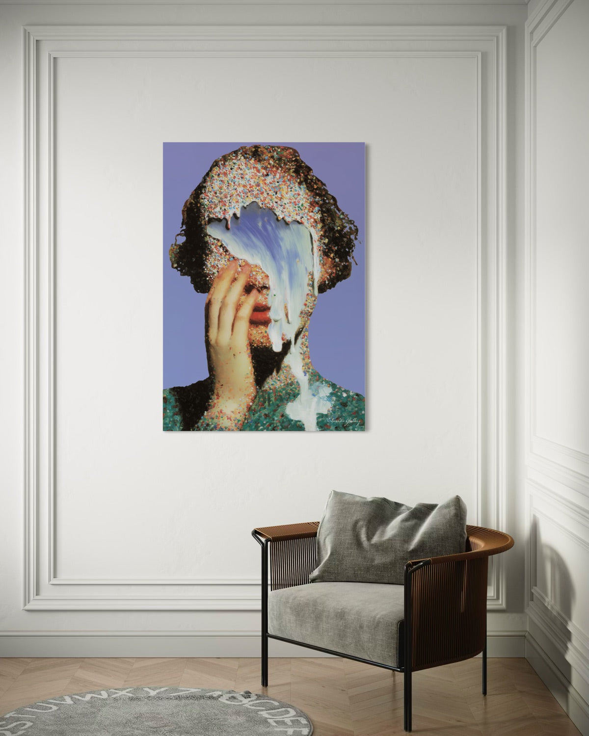 Framed artwork on a wall above a modern chair with a gray cushion.