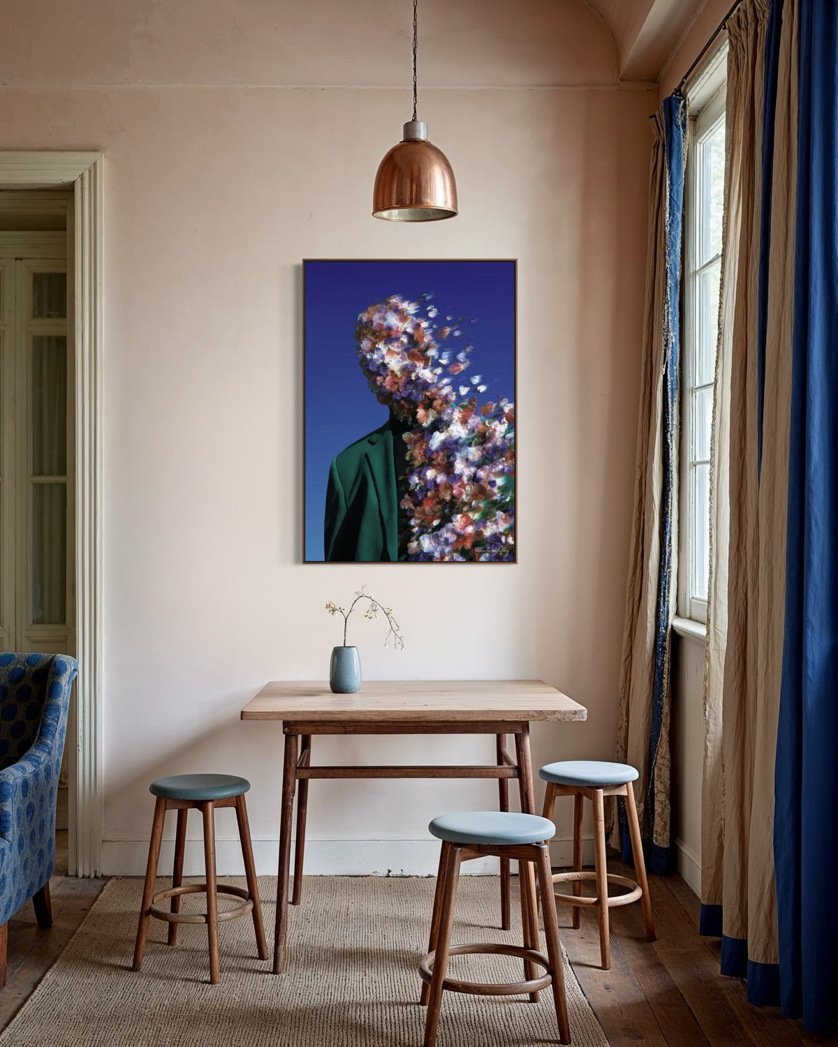Room interior with a table, stools, and a colorful wall art piece.