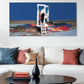Living room with a large abstract painting on the wall above a white sofa.