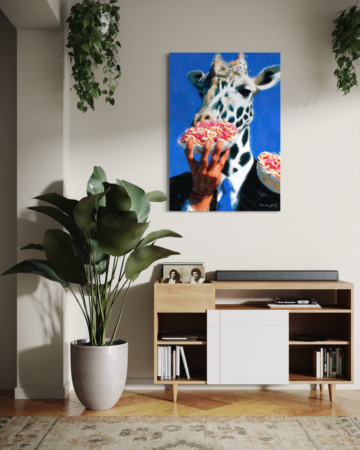 Living room with a giraffe painting on the wall, potted plant, and wooden cabinet.