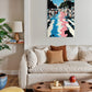 Living room with a beige sofa, wooden coffee table, and colorful abstract painting on the wall.