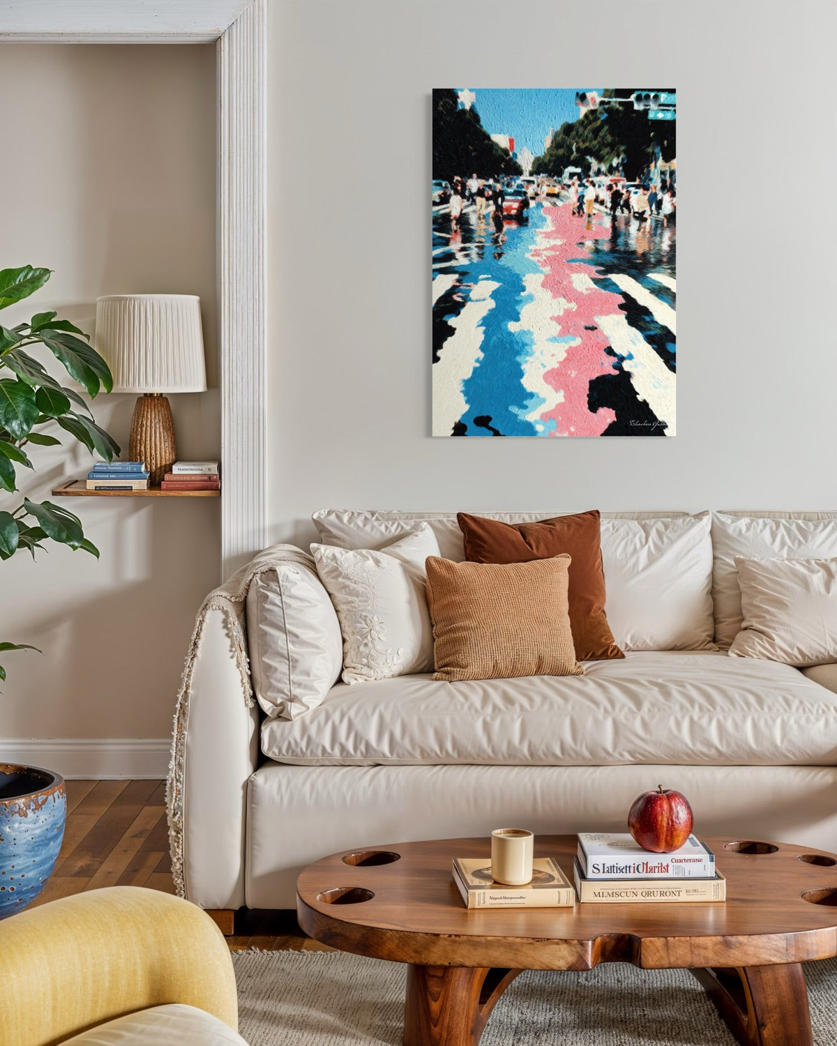 Living room with a beige sofa, wooden coffee table, and colorful abstract painting on the wall.