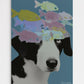Striking contemporary surrealist collage wall art print featuring an intimate black and white portrait of a spaniel dog wearing an abstract, colorful swarm of translucent floating fish as a crown against a deep blue-grey background, titled "Symmetry of Strangers."